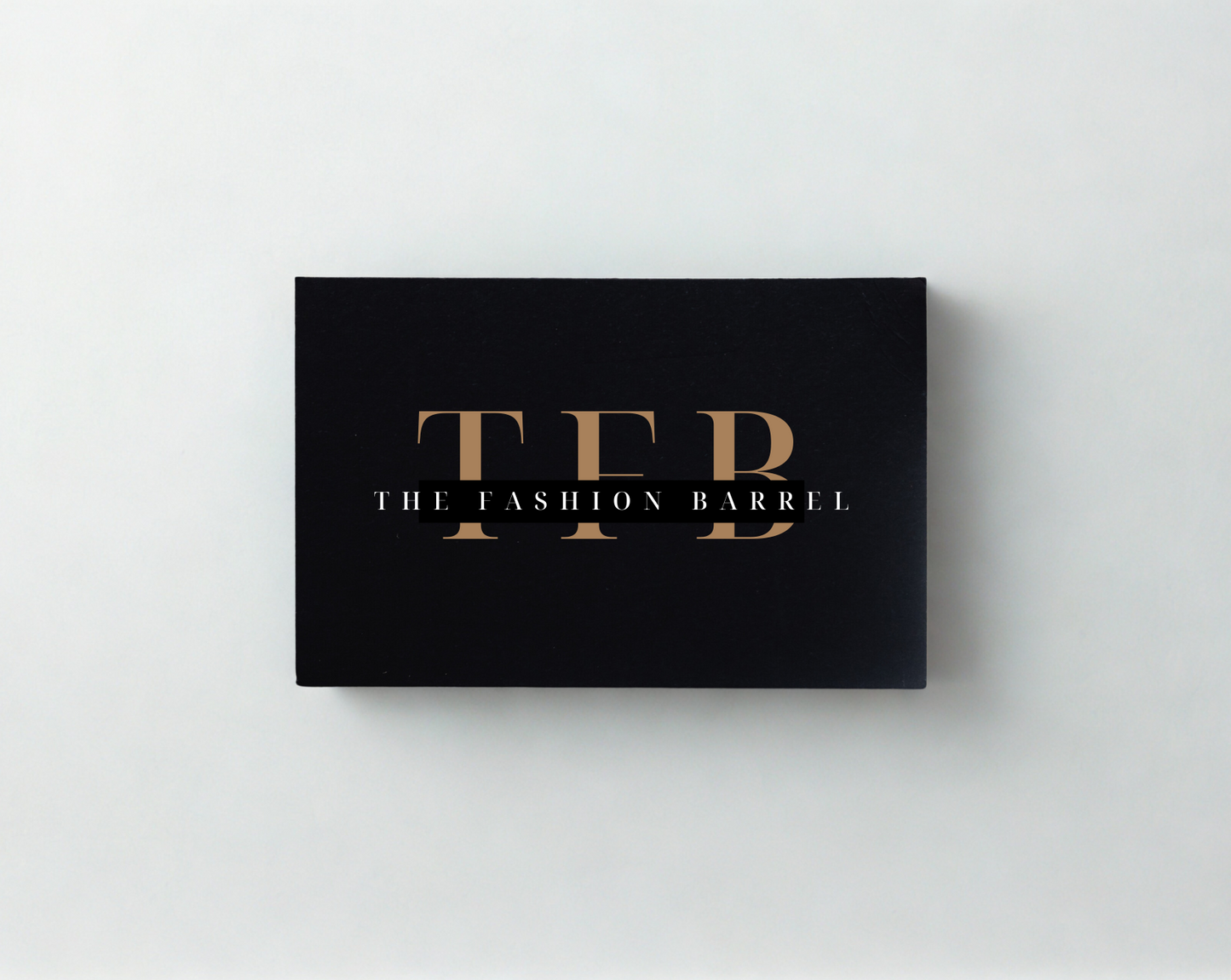 A black gift card with gold and white text.