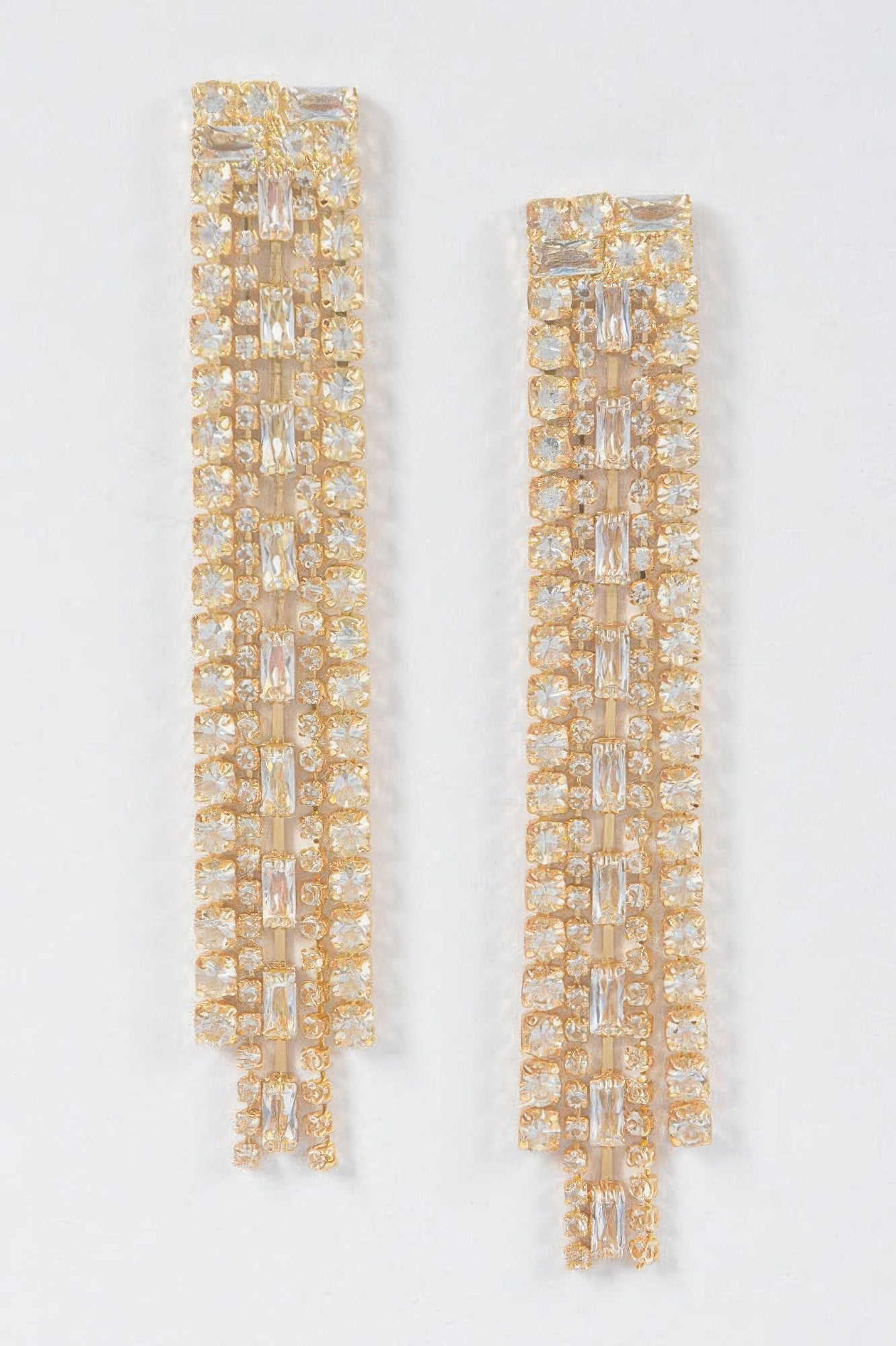 Gold rhinestone earrings.