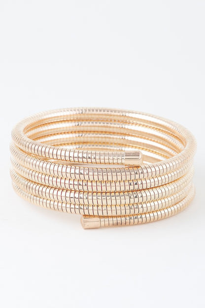 A gold snake chain wrap bracelet.