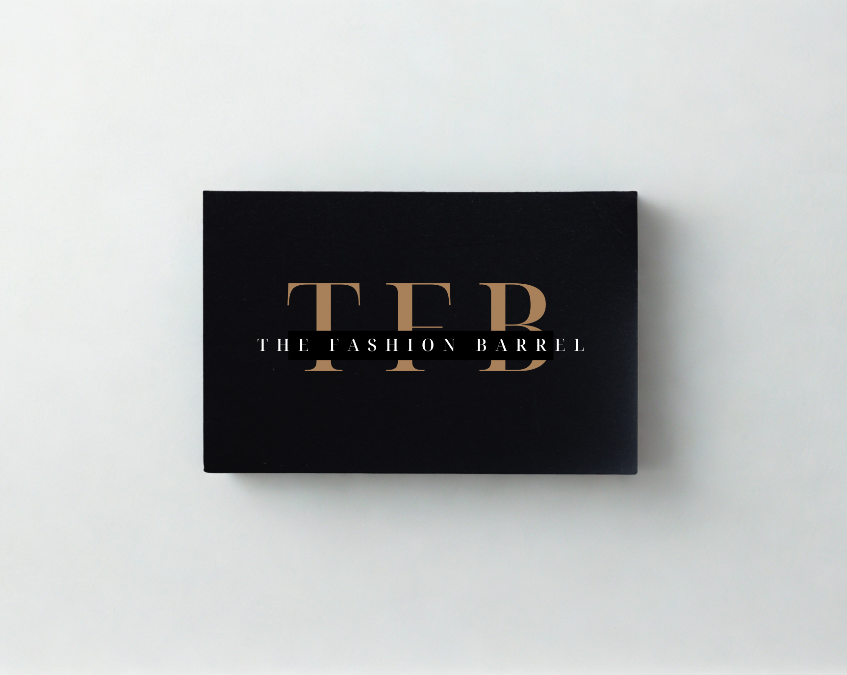 A black gift card with gold and white text.
