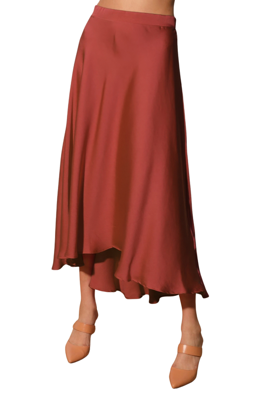 A woman posing in a brown washed poly silk midi swing skirt.