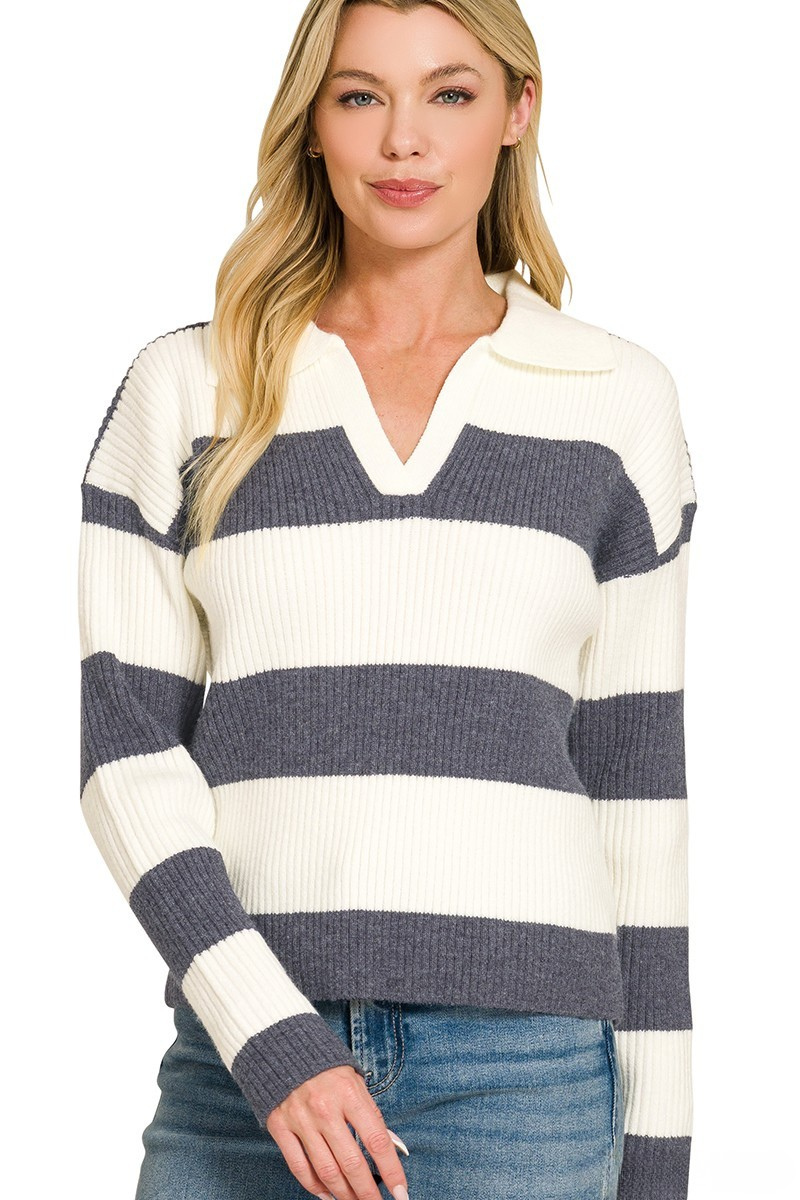 A woman posing in a blue indigo and white striped collar sweater.