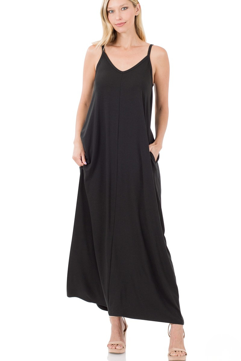 A woman posing in a black v-neck cami pocket maxi dress.