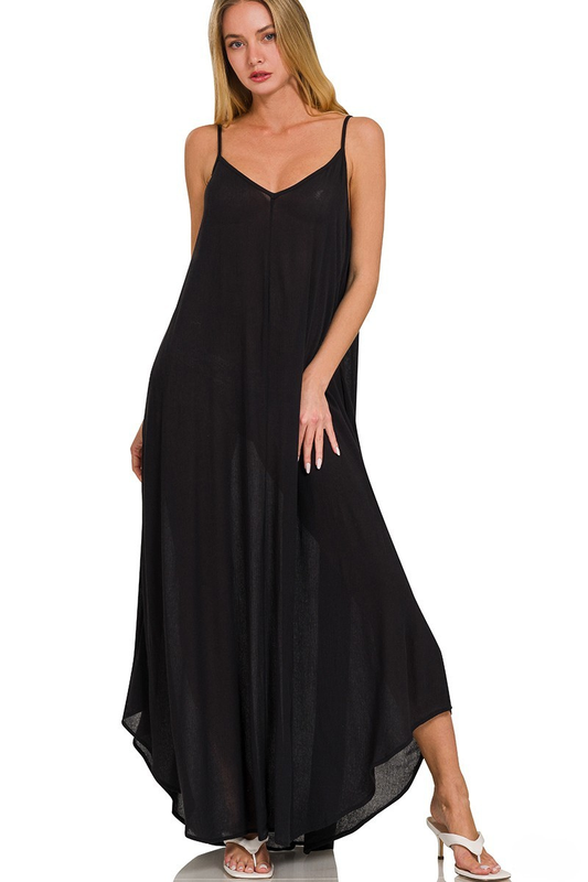 A woman posing in a black woven crinkle cami pocket maxi dress.